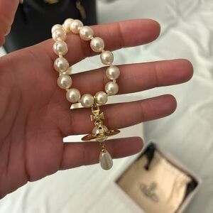 Vivienne Westwood Cream Pearl Bracelet with Gold Orb Charm
